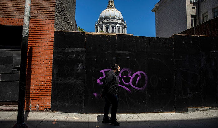 Anthony Alexander walking near City Hall, San Francisco CA.