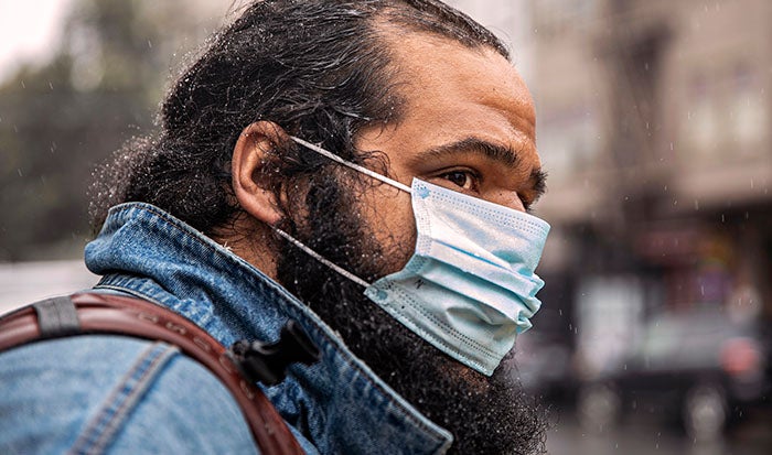 Anthony Alexander wearing a mask in the rain, San Francisco, CA.