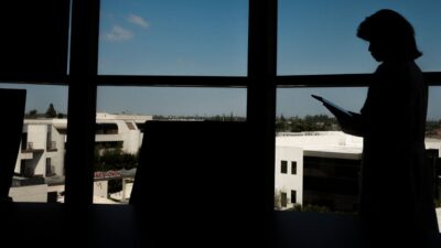 Shela Kaneshiro at work in her office