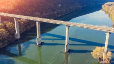 Overhead shot of a long bridge spanning a river