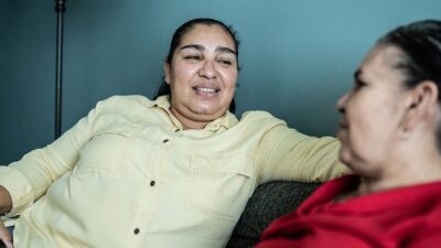 Younger woman having a conversation with older woman