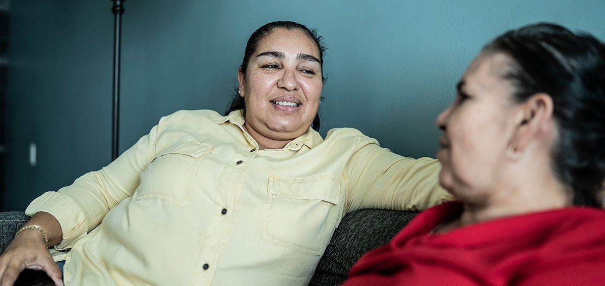 Younger woman having a conversation with older woman