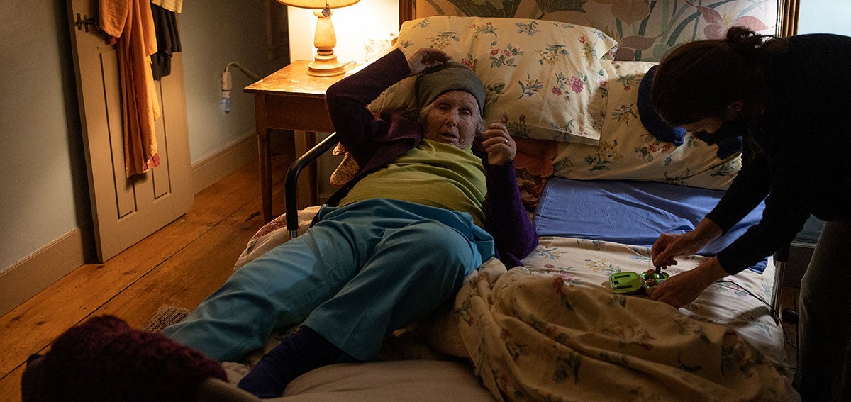 Elderly woman at home receiving medical care