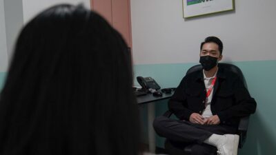 Unidentified patient with therapist Alvin Fong at the Chinese Service Center clinic in Chinatown