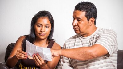 Couple reviewing a form together.