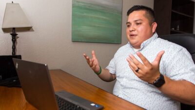Mike Lopez, a LCSW trainee, meets with his pre-licensure supervisor by video conference.