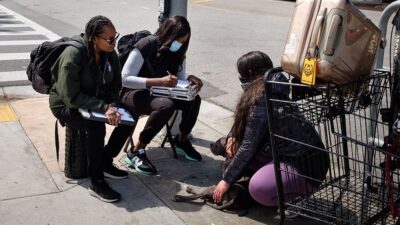 Street medicine team from Venice Family Clinic speaks with person experiencing homelessness.