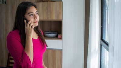Woman talking on telephone