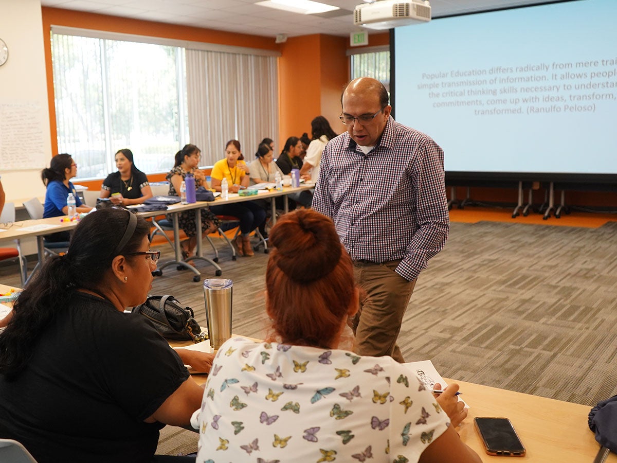 Man giving presentation to a room full of people