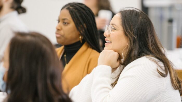 Photo of meeting participants engaged in a presentation for the CIN partner meeting in March 2023.