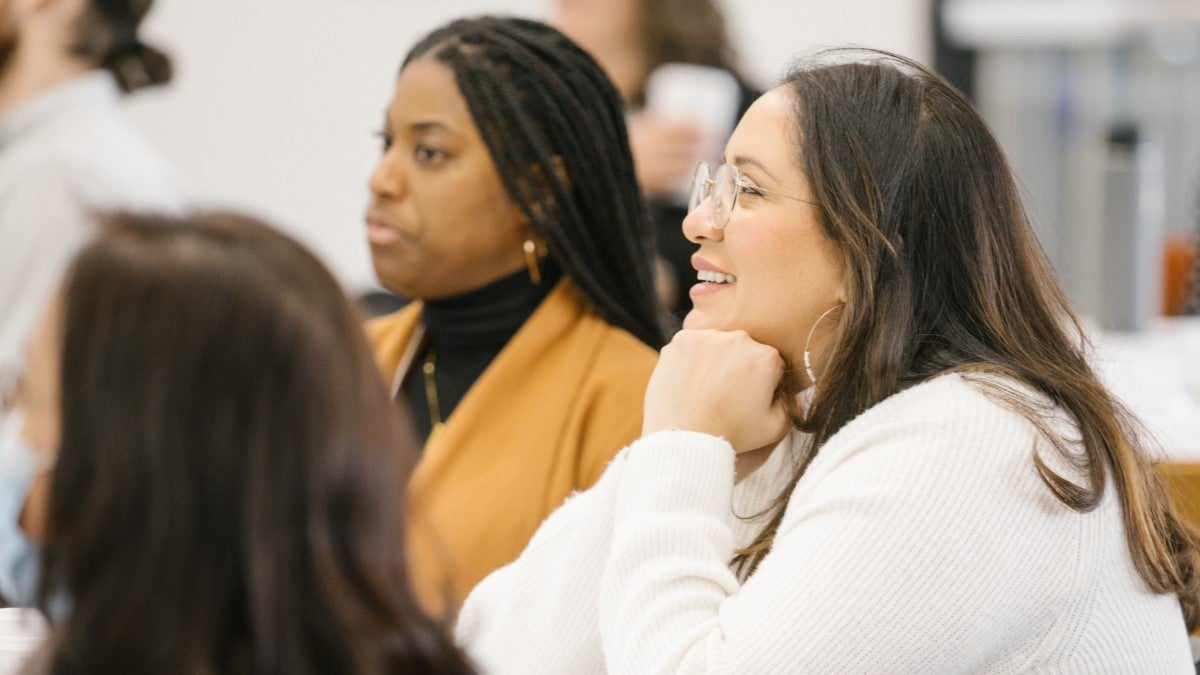 Photo of meeting participants engaged in a presentation for the CIN partner meeting in March 2023.