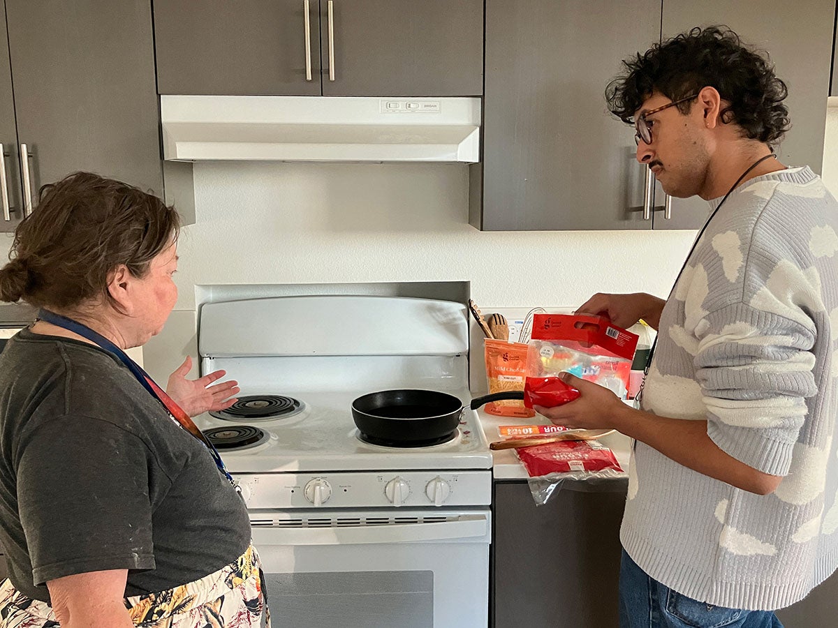 In Los Angeles, occupational therapists like Julian Prado are helping people like Carla Brown adapt to indoor living and stay housed.