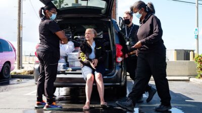Woman experiencing homelessness receives care from a street medicine team.