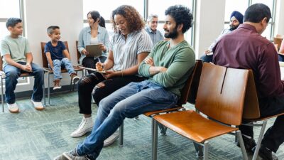 Crowd of people win a medical office waiting room