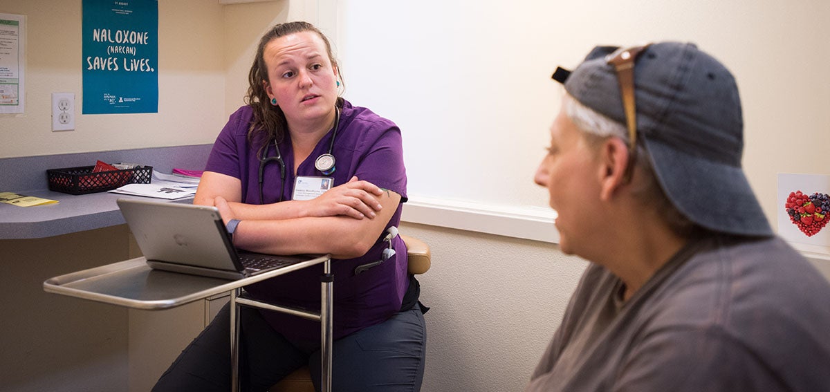Patient and provider talk during clinic visit.