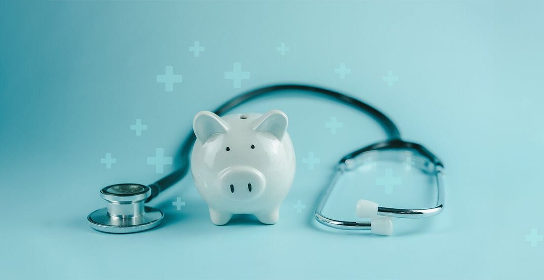 Piggy bank with stethoscope draped around it.