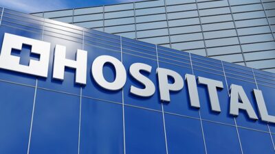 Glass building with "Hospital" sign