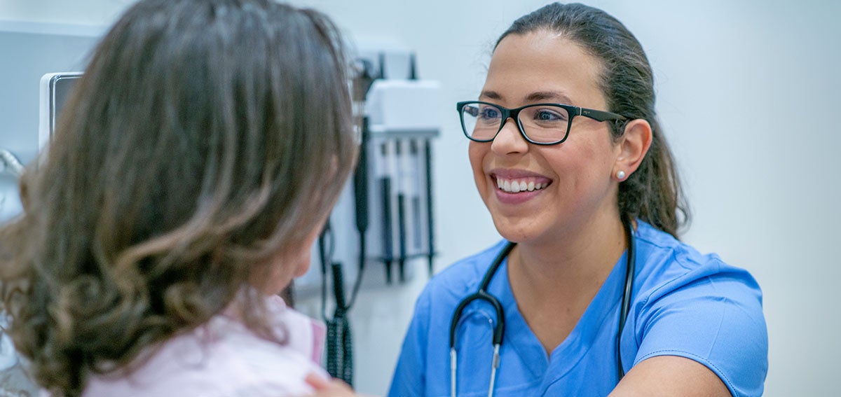 Nurse Practitioner with Patient in exam room