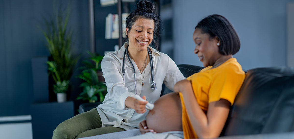 Patient at office visit with midwife.