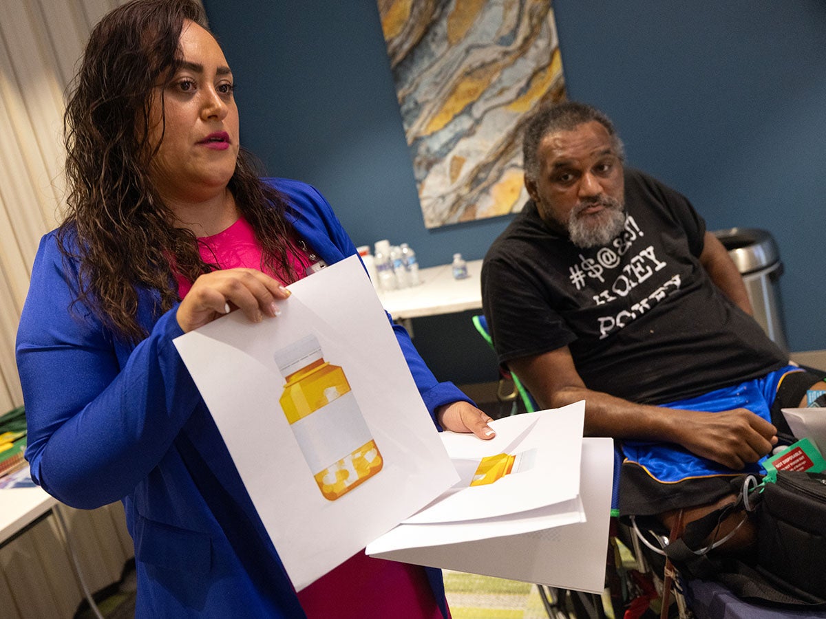 Case Manager Laura Gomez-Cancino speaking to a CCBCH session.