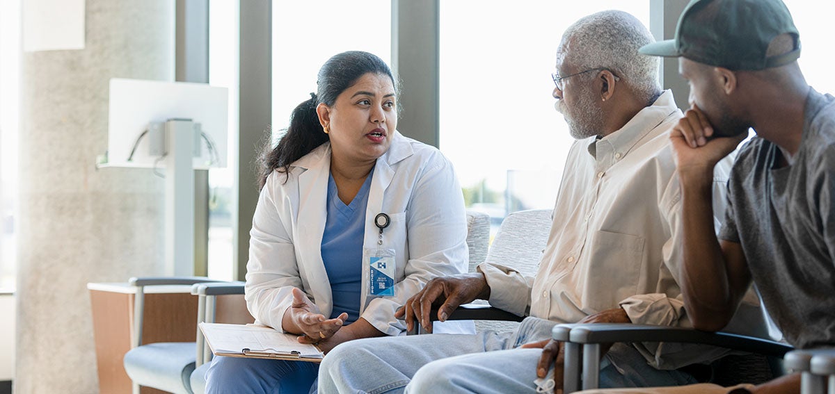 Doctor talks to patient and family member