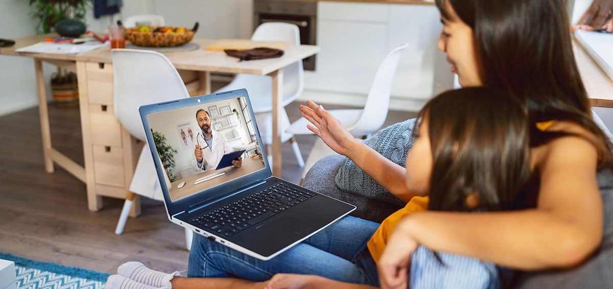 Mother and daughter talking to doctor on a telehealth visit