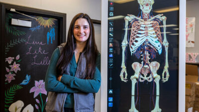 Sierra Stevens with computerized training equipment for future health care workers at Calaveras High School. She graduated from the program and is now completing her nursing education. She plans to stay in the area and work at the local hospital.