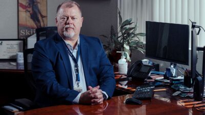Eastern Plumas Health Care CEO Doug McCoy sitting at a desk