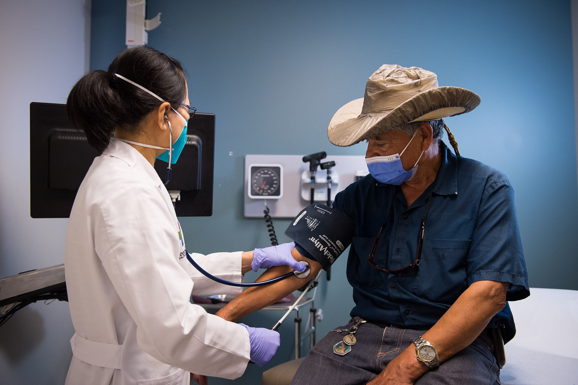 60 years of Medicaid - Older man having his blood pressure taken at a doctor's office