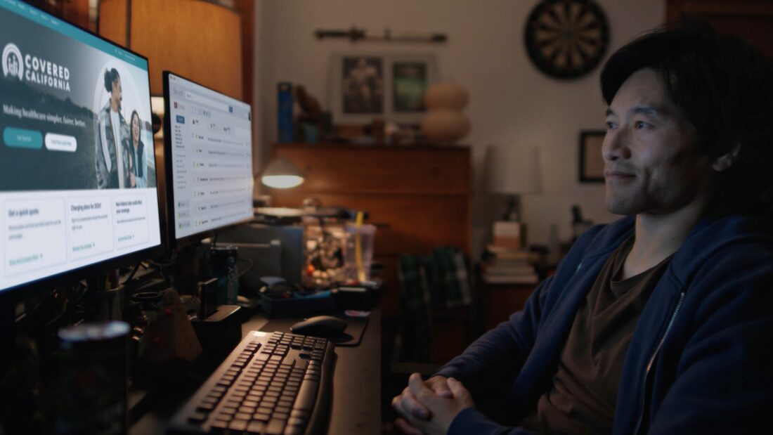 Covered California premiums 2026 - Man reviewing Covered California website on desktop computer