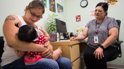 Mother and child in Dr. office with physician