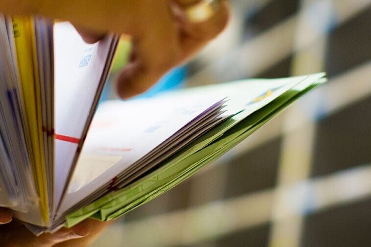 Hands sorting mail