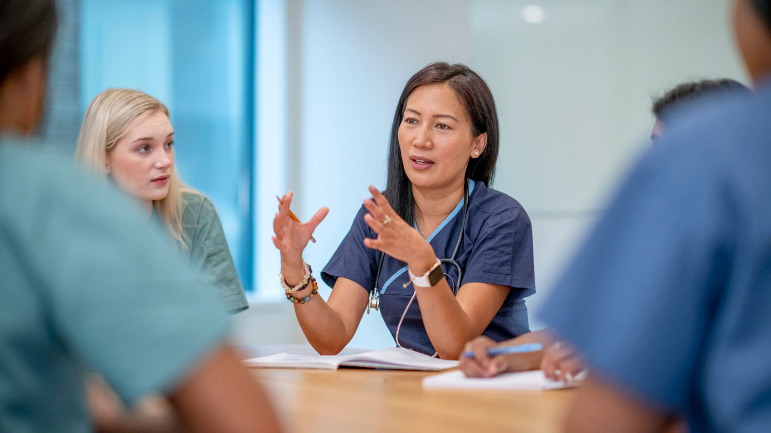 nurses talking in a meeting