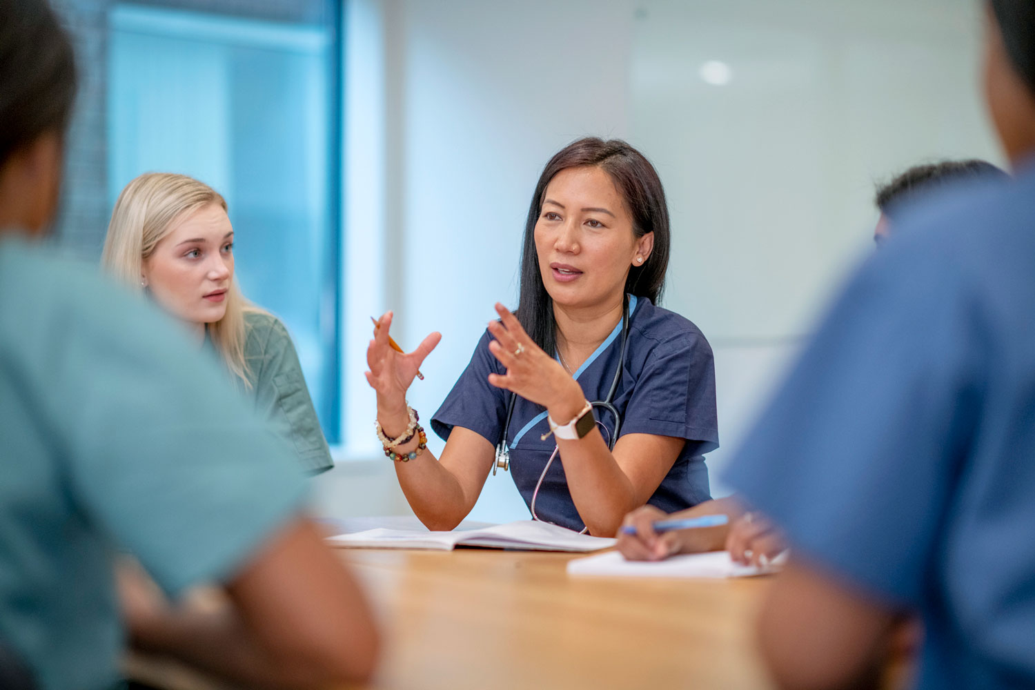nurses talking in a meeting