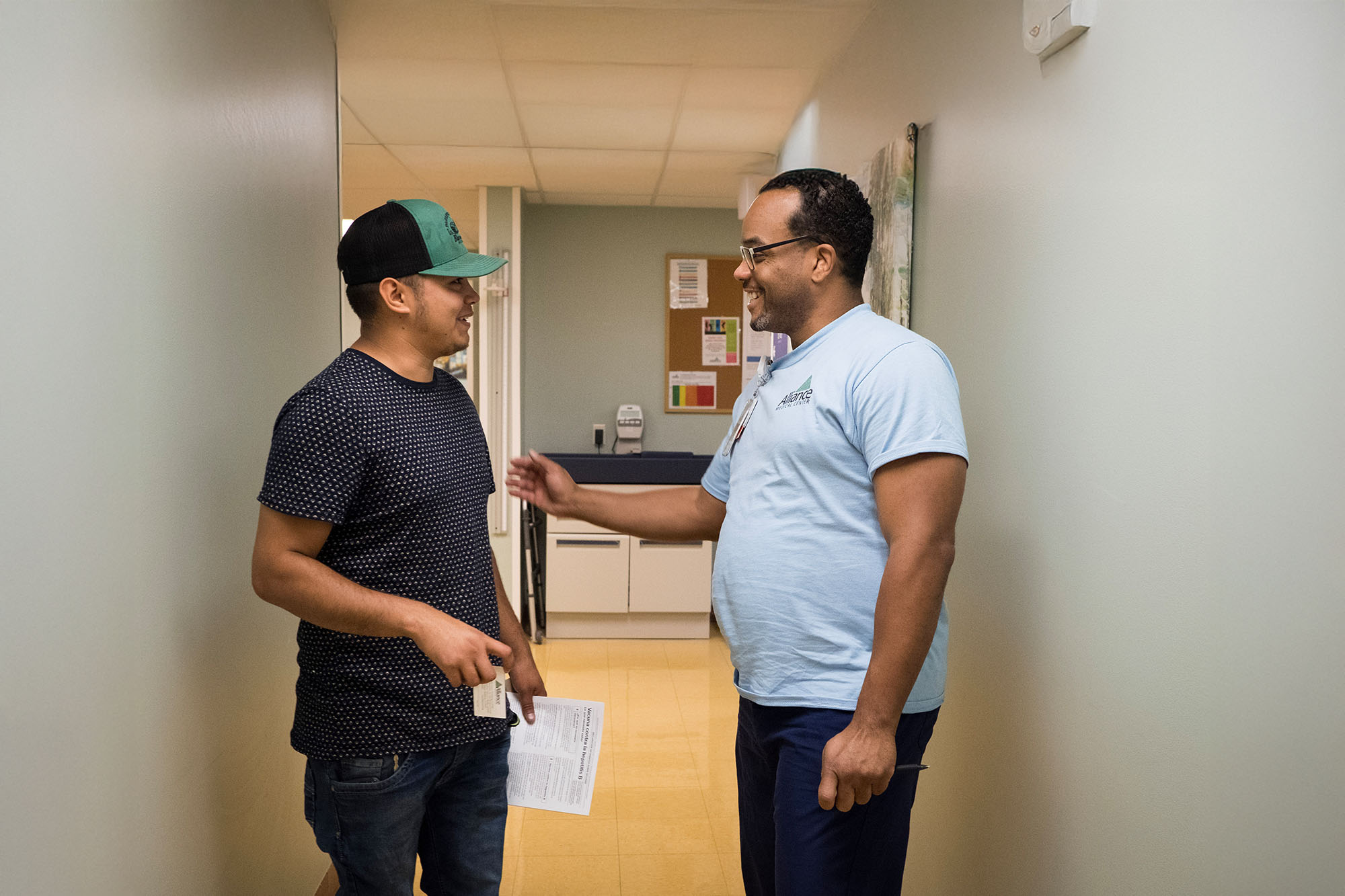 Doctor and patient have a freindly conversation in a clinic.