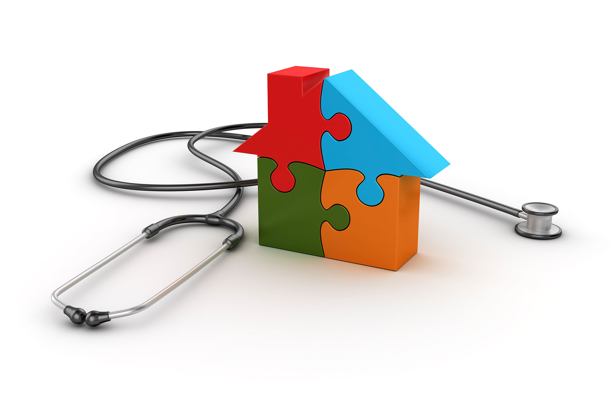 House made of four brighly colored puzzle pieces next to a stethoscope