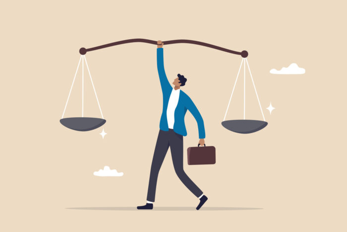 Man balancing ccales